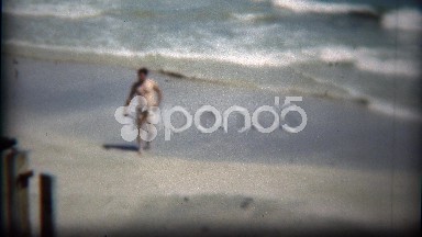 1954: Man Walking Alone on Beach as Waves Crash in Jacksonville