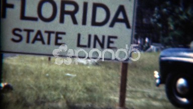 1954: Florida state line black classic car parked documented. JACKSONVILLE,