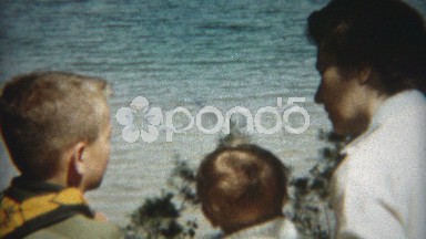 1955: Mother giving boy scout advice with young baby girl present. CHICAGO
