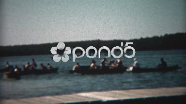 1955: Summer camp boat sinking game fun splashing lake water from buckets.