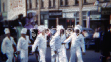 1951: Riders on the bay parade float pulled by chefs dressed in white. ERIE,