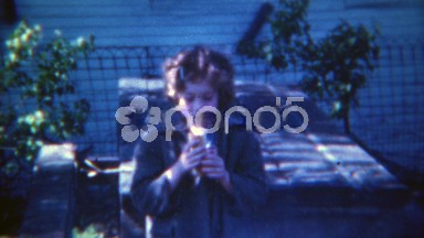 1953: Skeptical girl eating hotdog in the shadows of society. PITTSBURG