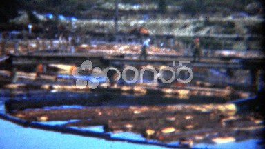 1949: Workers Walking Around Floating Logs in Yard Water Industrial Zone