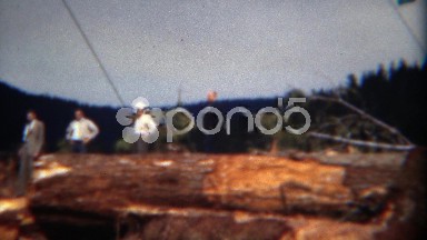 1949: Management visits logging operation of 1000 year old growth trees. DEL