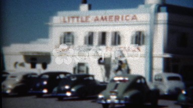 1949: Little America hotel cabins gas station rest stop care bar historic scene.