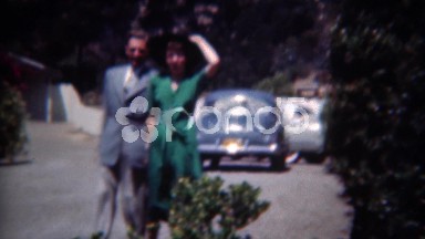 1949: Lovers on holiday getaway women in green fashion dress. ERIE,