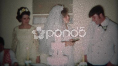 1966: Newlyweds cut and feed eat other white wedding cake. CINCINNATI, OHIO
