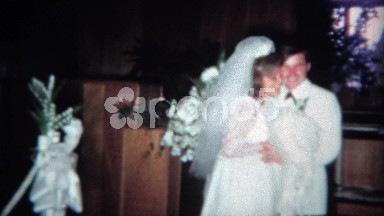 1966: Newly married couple posing with wedding party. CINCINNATI, OHIO