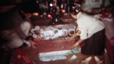 1962: Siblings unwrap Christmas gift model car racing toy track kit. BUFFALO,