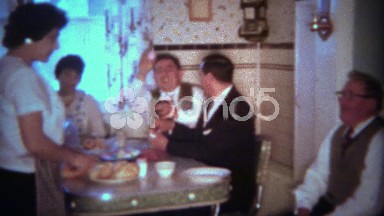 1963: Easter eggs passed around during holiday kitchen dining event. BUFFALO,