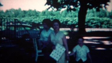 1961: Guests arriving for party with trays of food and gifts. CINCINNATI, OHIO
