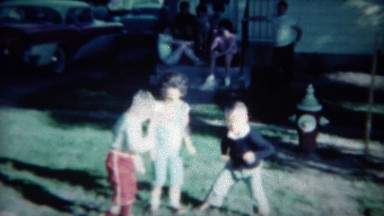 1961: Toddler Kids Practice Twist Dance Craze in Sunny Front Yard