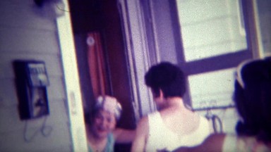 1971: Women in Curlers Open Door to Surprised Friendly Visitors, Des Moines, Iowa