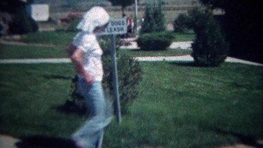 1972: Religious teenager visits interstate rest stop keep dogs on leash sign.