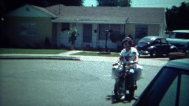 1972: Motorcycle ride around the cul de sac with mother holding on tight. SAN