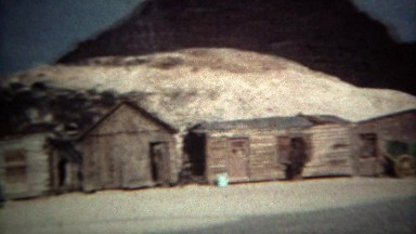1973: Ghost town wagon trail log cabins and western railroad trains. RENO,