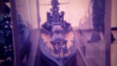 1973: USS Arizona ship memorial model and ship top breaching waterline. PEARL