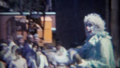 1964: Creepy clowns at parade salutes military heroes. BUFFALO, NEW YORK