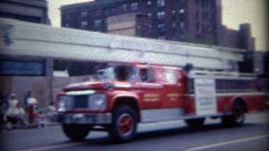 1964: Red Fire Department Truck Brigade Parading Through Buffalo, New York
