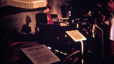 1964: Man visits dark old car museum Luray Caverns police department. LURAY,
