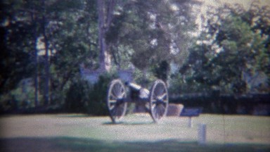 1961: Men climbing on historic civil war cannons like children. FREDERICKSBURG,