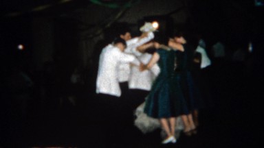 1966: Wedding couple dancing under human bridge. BUFFALO, NEW YORK