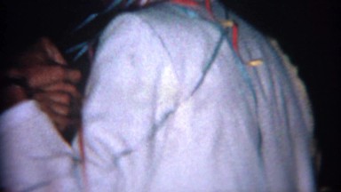 1966: Wedding couple streamer tied together dancing. BUFFALO, NEW YORK