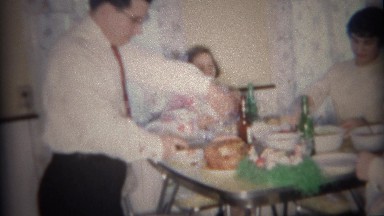 1959: Dad Slices Holiday Ham for Family at Modest Diner Table, Buffalo, New York