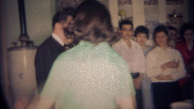 1959: Women Joins Family Picture of Solemn Angry Clan. Buffalo, New York