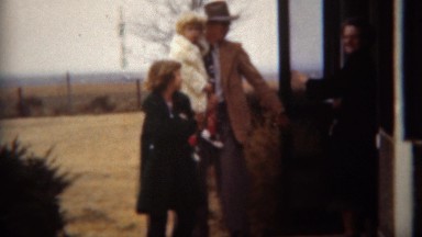 1951: Farmer family leaving house for Sunday church. LINCOLN, NEBRASKA