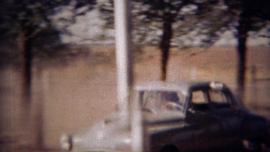 1951: Fast gray car brings guests to formal event. LINCOLN, NEBRASKA