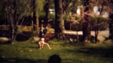 1948: Girl Balances on Head and Crab Walks Across Yard, Denver, Colorado