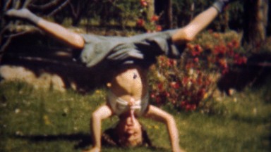 1948: Girl Balancing on Her Head Closeup Falls Over in Denver, Colorado