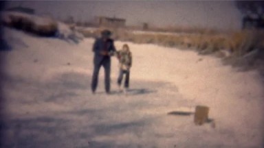 1951: Father daughter winter ice skating in local ditch near house. GREELEY,