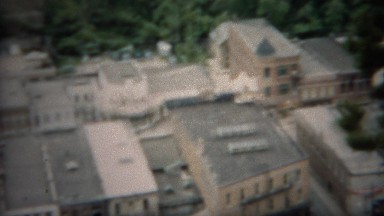 1953: Downtown hillside view of famous town and main street buildings.
