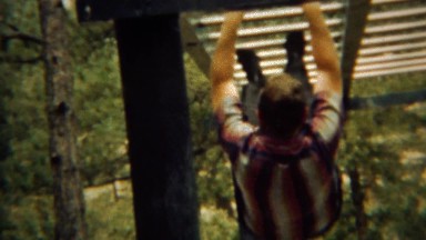 1966: Middle aged man monkey bar fail as military son laughs. U.S. AIR FORCE