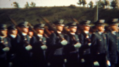 1966: Armed soldiers marching in perfect sync with shouldered rifle guns. U.S.