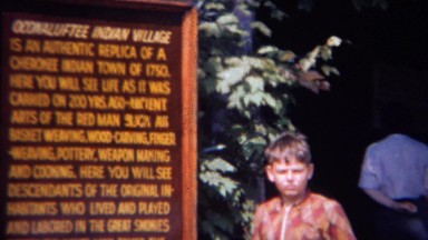 1966: Boy pretends to learn about Oconaluftee Indian Village. GREAT SMOKY