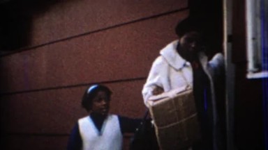 1967: Mother bringing package to post office to mail during Christmas. CARMEL,