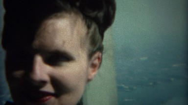 1968: Women atop the Empire State Building at same height as blimp. NEW YORK
