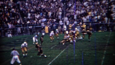1969: Purdue college football team scores passing touchdown, crowd goes mad.