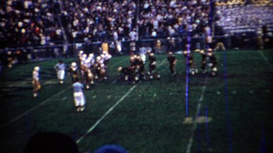 1969: Purdue college football team kicks a field goal scoreboard shows big lead.