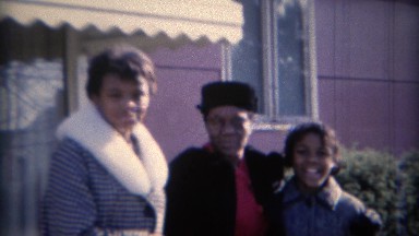 1969: Teenager laughs and grandma agrees at the hilariousness. CARMEL, INDIANA