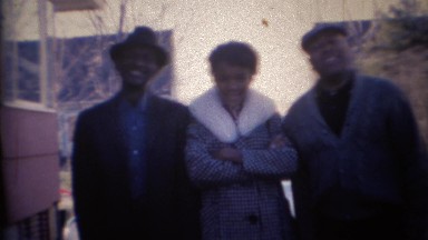 1969: Family leaves in white early 60's Lincoln giant car. CARMEL, INDIANA