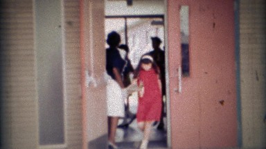 1969: School teacher leaving class early with her daughter. CARMEL, INDIANA