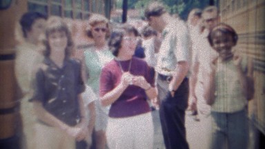 1969: School bus field trip day kids multicultural event.