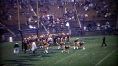 1969: Purdue College football team practice ball snapping drills.