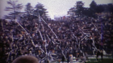 1969: College football stadium crowd celebrating with toilet paper streamers.