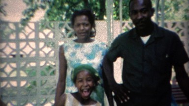 1969: African family reunion outdoor summer patio.