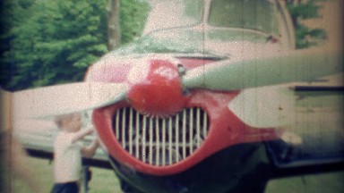 1971: Kid Airplane Mechanic Working on Private Propeller Aircraft
